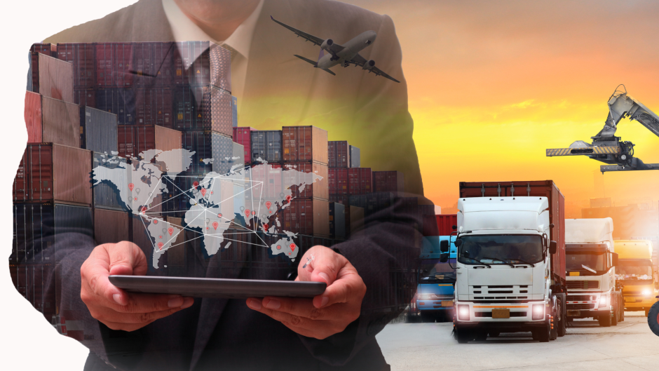 man in a suit holding a tablet with a map of the world projected, then in the background trucks, an airplane, and cargo containers.